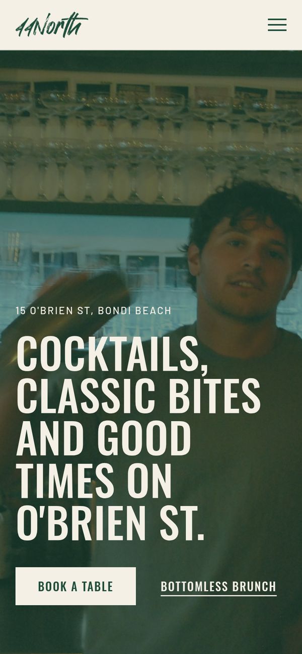 The 44North homepage on a phone, with the headline 'Cocktails, classic bites and good times on O'Brien St.' and a Book a table button